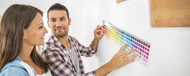 Man and Woman checking wall paint colors